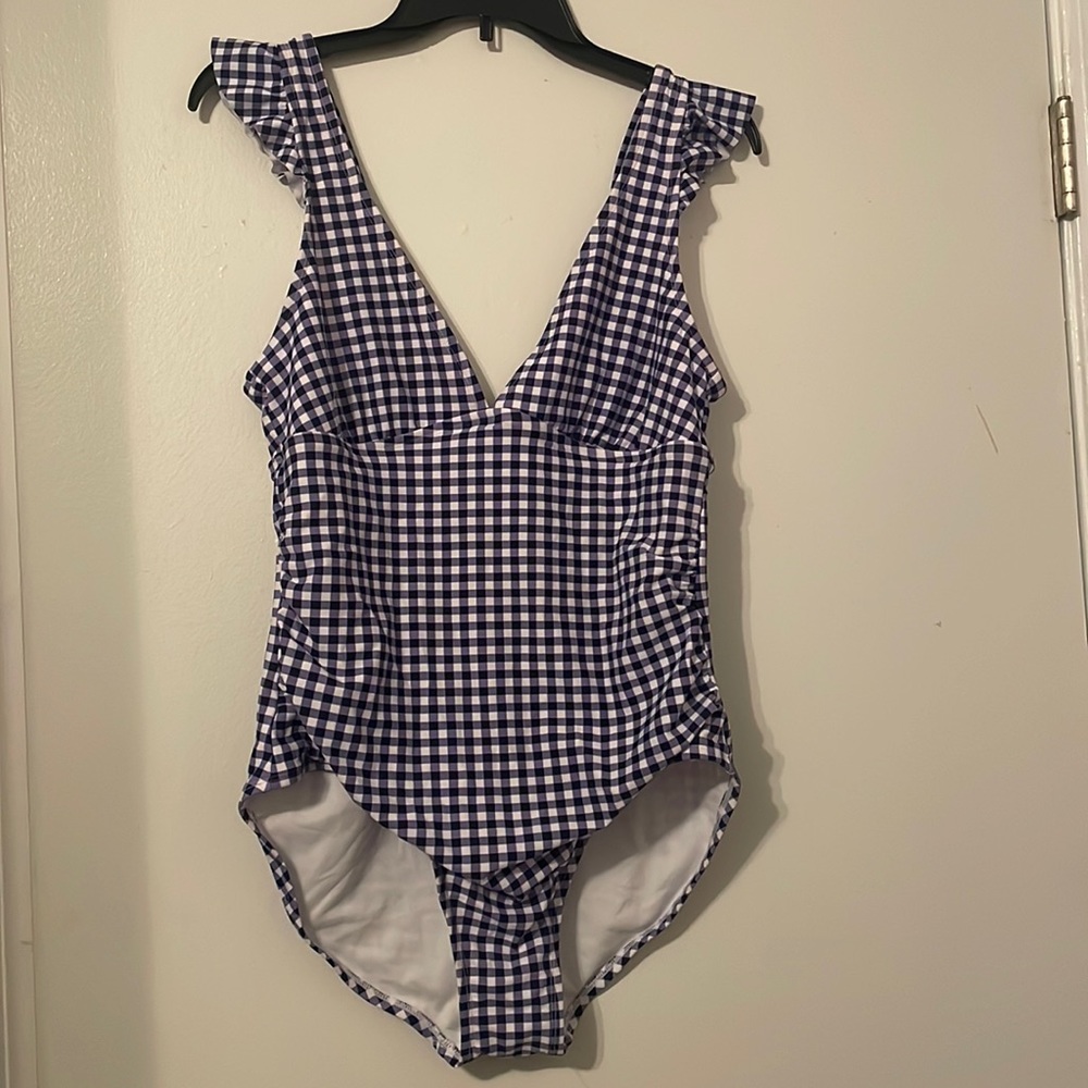 Swimsuit size large (12/14) super cute and like new. Only worn a couple times.